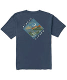 A dark denim blue Vissla Seascape organic short-sleeved tee with a graphic print of a seascape on the front.
