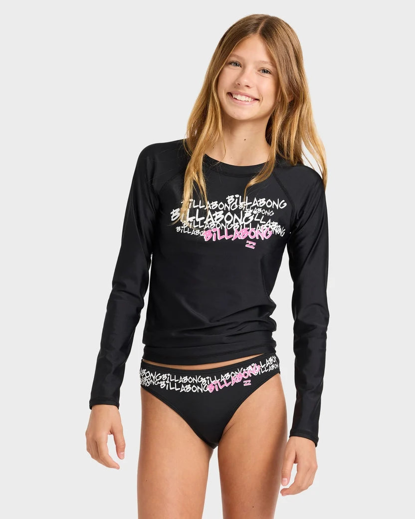Girl wearing a black long-sleeve shirt and black bikini bottom with colorful patterns on a white background