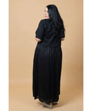 Woman wearing a black dress against a beige background Charlo Greta Dress - Black