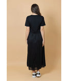 Woman wearing a black dress against a beige background Charlo Greta Dress - Black