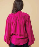 Person wearing a bright pink blouse against a beige background Charlo Jontee Long Sleeve Top - Pink
