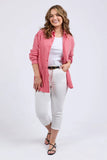 Woman wearing a red and white striped shirt with white pants on a white background Elm Frankie Striped Shirt - Caynene Stripe