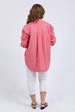 Person wearing a red and white striped shirt and white pants on a white background Elm Frankie Striped Shirt - Caynene Stripe