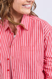 Close-up of a person wearing a red and white striped shirt against a light gray background Elm Frankie Striped Shirt - Caynene Stripe