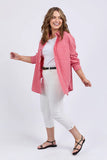 Woman wearing a red and white striped shirt with white pants on a white background Elm Frankie Striped Shirt - Caynene Stripe