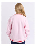 Person wearing a pink sweatshirt with red trim on a white background Eve Girl Cherry Hearts Crew - Pale Pink