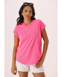 Woman wearing a bright pink t-shirt with a subtle pattern on a light pink background