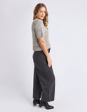 Woman wearing a patterned sweater and dark pants on a white background Foxwood Davana Knit - Oat Marle