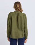 Person wearing an olive green blouse with long sleeves on a white background Foxwood Eleanor Top - Winter Moss