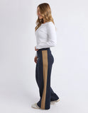 Woman wearing navy pants with a beige stripe on a white background Foxwood Juno Pant - Ink