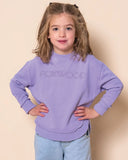 Child wearing a purple sweatshirt with 'FOXWOOD' logo on a beige background Foxwood Kids Simplified Crew - Lavender