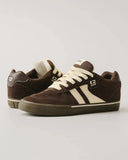 Pair of brown sneakers with white accents on a light gray background