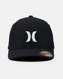 A black structured baseball cap featuring a white embroidered Hurley logo on the front and a gold-toned size sticker on the brim, set against a light gray background.