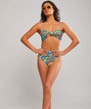 A model wearing a multicolored bandeau bikini top with a front knot detail, featuring thin removable shoulder straps and side boning.