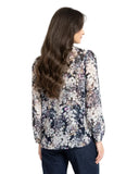Leila and Luca Prowl Top in Mirage animal print, showing the relaxed long-sleeve women's blouse with an elegant draped fit and earth-toned pattern details.