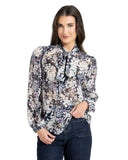 Leila and Luca Prowl Top in Mirage animal print, showing the relaxed long-sleeve women's blouse with an elegant draped fit and earth-toned pattern details.