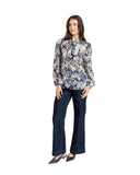Leila and Luca Prowl Top in Mirage animal print, showing the relaxed long-sleeve women's blouse with an elegant draped fit and earth-toned pattern details.