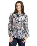 Leila and Luca Prowl Top in Mirage animal print, showing the relaxed long-sleeve women's blouse with an elegant draped fit and earth-toned pattern details.