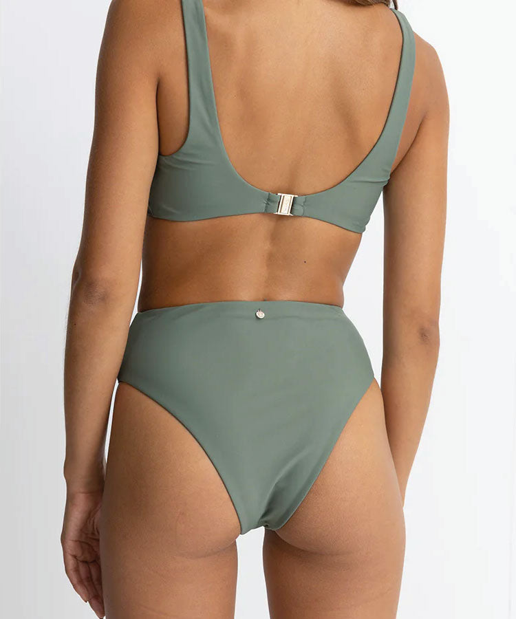 Person wearing a green bikini on a white background. Rhythm Classic Hi Waist Pant - Olive
