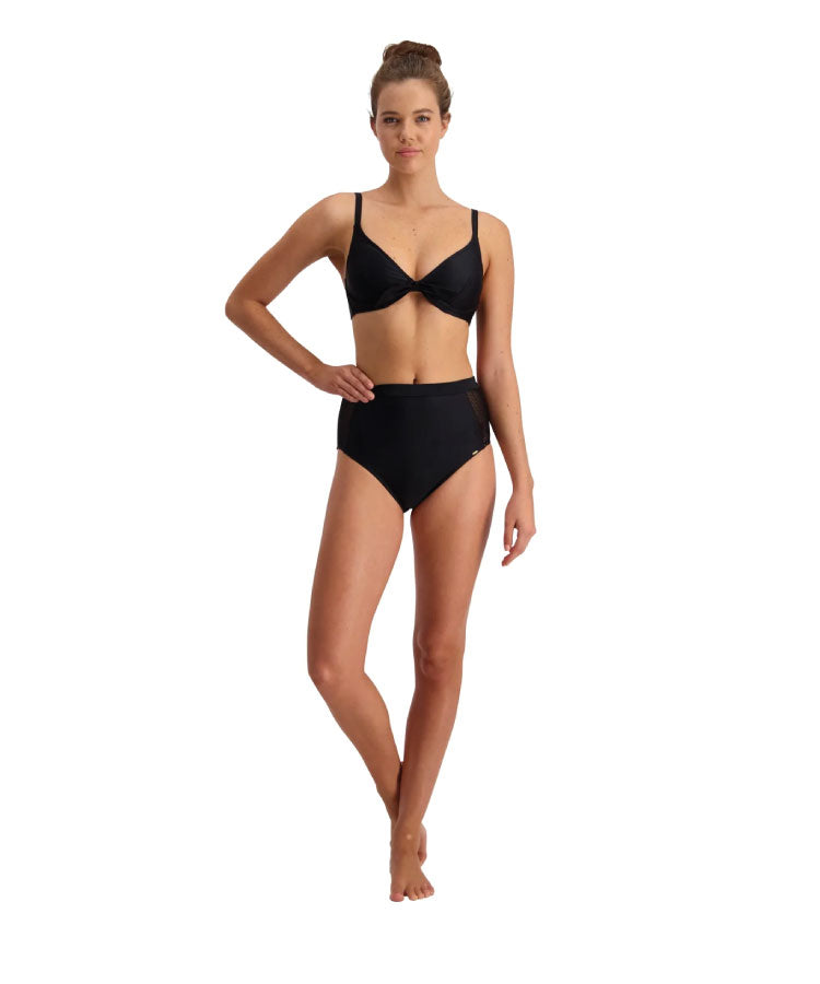 A model wearing a solid black high-waisted bikini bottom with mesh detailing and a matching bikini top.