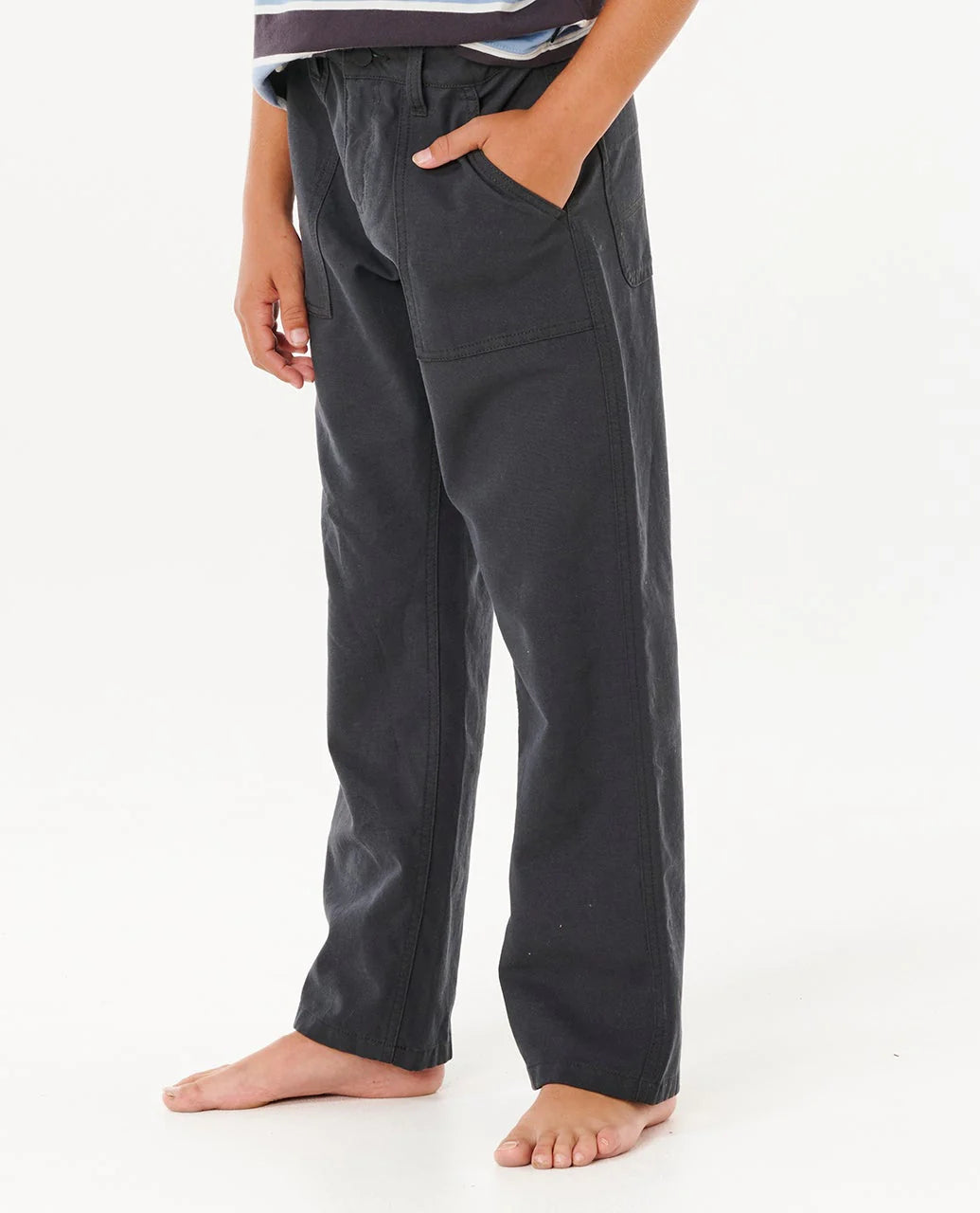 Person wearing dark gray pants on a white background Rip Curl Hyped Canvas Boys Pants - Washed Black