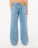 Light blue jeans worn by a person on a white background