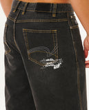 Black jeans with a decorative pocket design on a white background