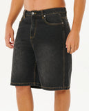Black denim shorts worn by a person on a white background