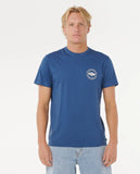 Man wearing a blue t-shirt with a logo on a white background
