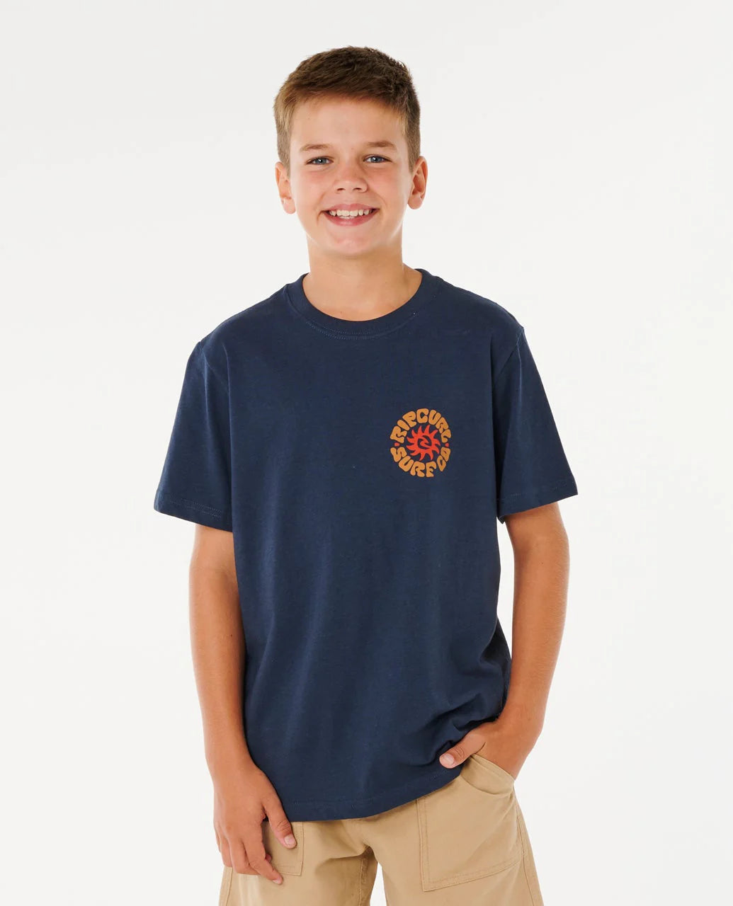 Young boy wearing a navy blue t-shirt with a logo on a white background