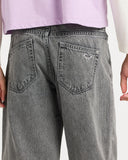 Gray jeans with a brand logo on the back pocket against a white background. Roxy Dawn Patrol Mid Lava Denim Jeans - Lava