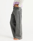 Person wearing gray jeans on a white background. Roxy Dawn Patrol Mid Lava Denim Jeans - Lava