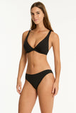 Woman wearing a black bikini on a white background