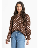 Seeking Lola Harper Top in Pink Polka dot print blouse, sold by Point Break Cambridge local family surf shop at 63 Duke street.