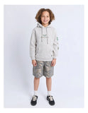 Child wearing a gray hoodie and camouflage shorts on a white background - Saint Goliath Wings Hoodie in Grey.