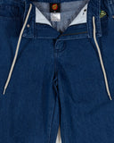 Close-up of blue jeans with a brand label visible. Santa Cruz Multi Cruz Stack Alien Boys Jeans - Stone Wash Indigo