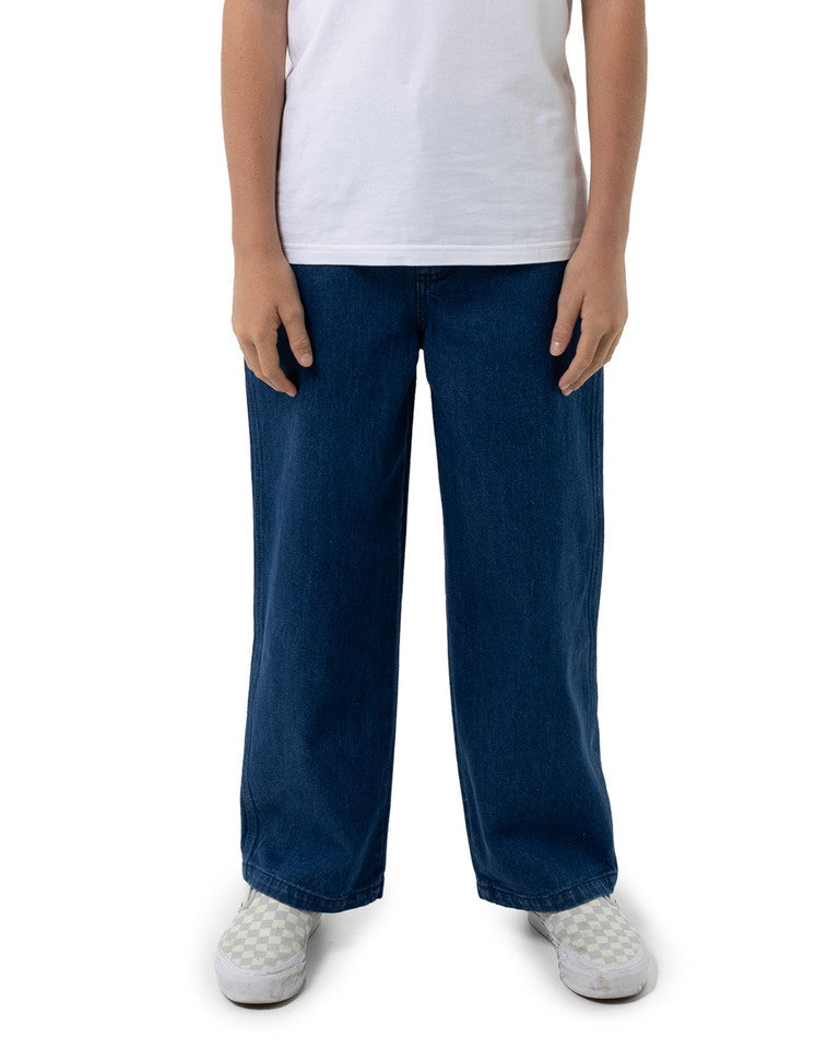 Person wearing blue pants and a white shirt on a white background Santa Cruz Multi Cruz Stack Alien Boys Jeans - Stone Wash Indigo