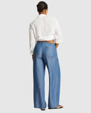 Sea Level Denim Surf Tide Pant in denim blue back view displayed at Point Break Cambridge, a local family surf shop.