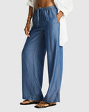 Sea Level Denim Surf Tide Pant in denim blue close up view displayed at Point Break Cambridge, a local family surf shop.
