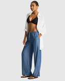 Sea Level Denim Surf Tide Pant in denim blue front side view displayed at Point Break Cambridge, a local family surf shop.
