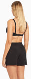 Back view of the ladies Sea Level mid length boardshorts displaying the flattering rear coverage and clean hemline.