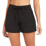 Front view of the Sea Level Essentials mid length women's boardshorts in black showing the comfortable waistband.