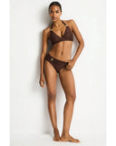 Woman wearing a brown bikini against a white background