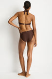 Person wearing a brown bikini set on a white background