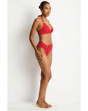 Woman wearing a red bikini against a white background