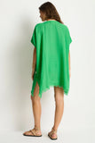Woman wearing the Sea Level Sunset Kaftan - Kelly Green with a white background