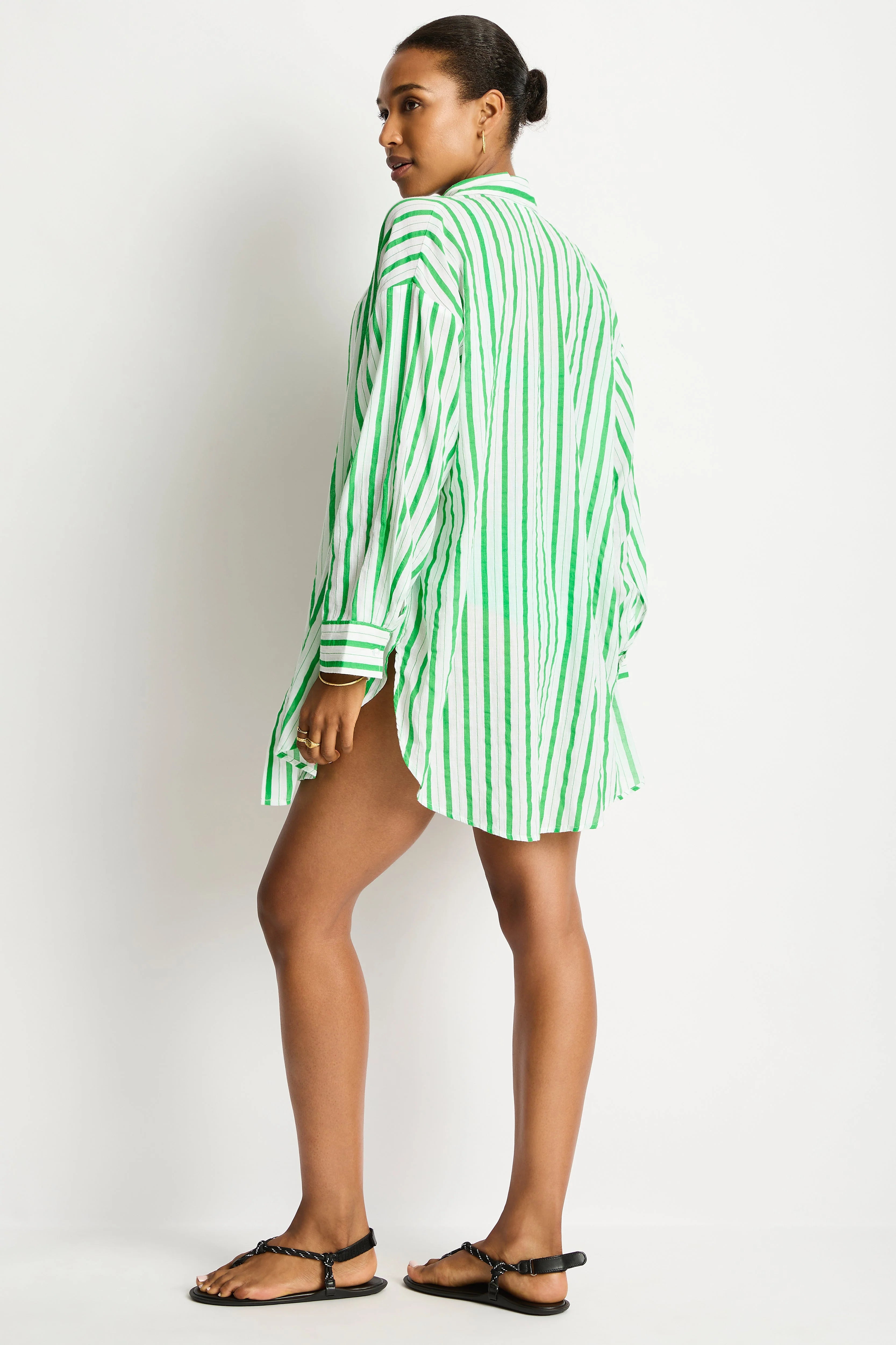 Person wearing a green and white striped shirt against a white background Sea Level Vacay Cruise Shirt - Kelly Green