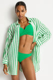 Woman wearing a green bikini with a matching striped cover-up against a white background Sea Level Vacay Cruise Shirt - Kelly Green
