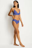 Woman wearing a blue and white striped bikini against a white background Sea Level Voyage Mid Bikini Pant - Amalfi Blue