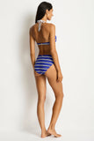 Woman wearing a blue and white striped bikini against a white background Sea Level Voyage Mid Bikini Pant - Amalfi Blue